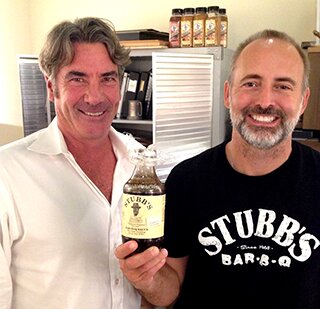 John Scott and Eddy Patterson with one of the first Stubb's bottles. Logo designed by Joe Ely.